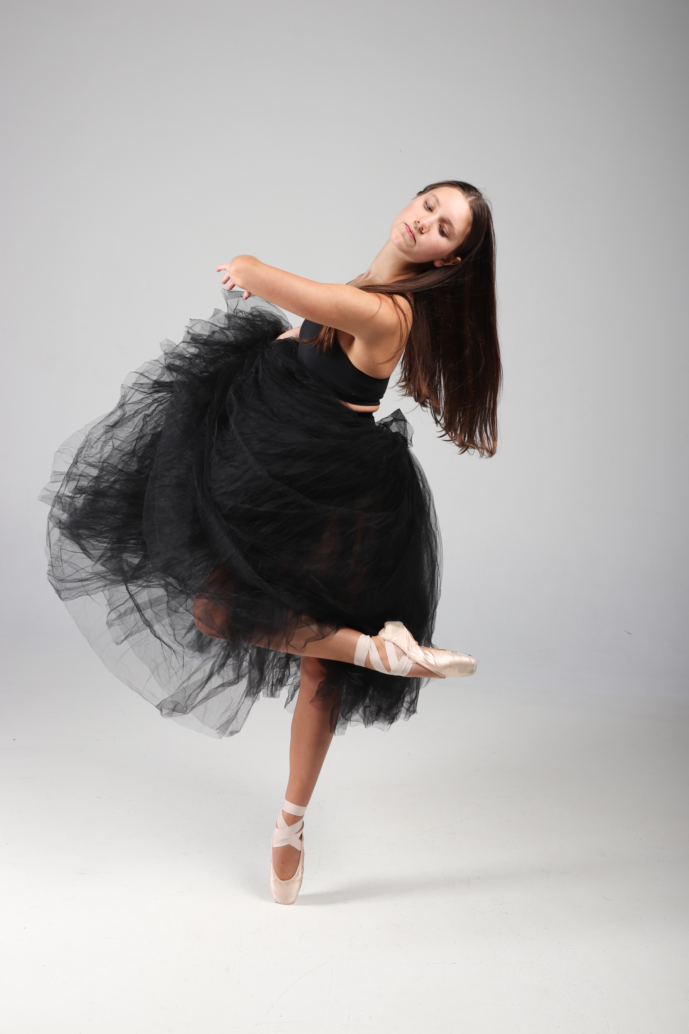 GWDC dancer moving expressively in a black tulle costume