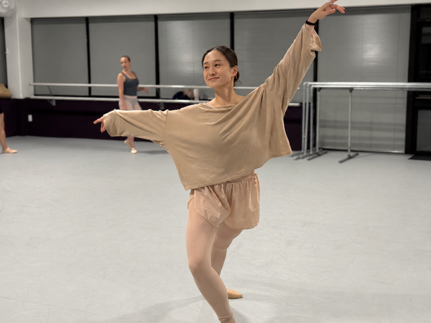 Adult dancer practicing an expressive arm position at GWDC